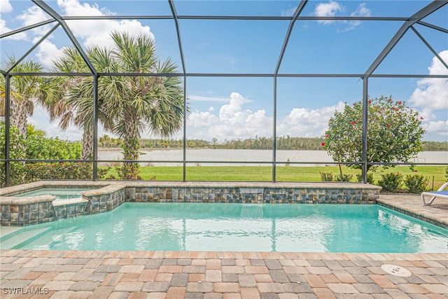 view of swimming pool with a patio, glass enclosure, and an in ground hot tub