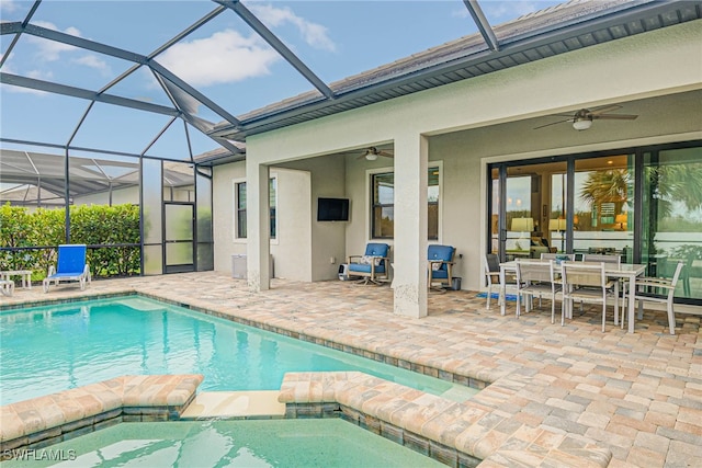 view of swimming pool featuring ceiling fan, an in ground hot tub, and a patio