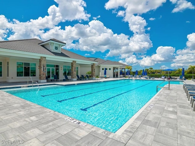 view of swimming pool featuring a patio