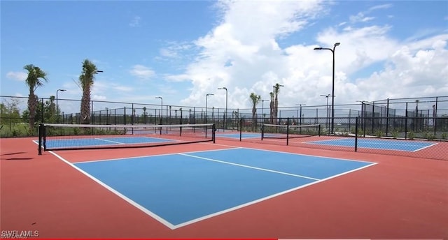 view of tennis court featuring basketball court