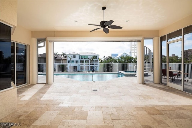 view of swimming pool featuring ceiling fan