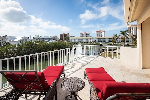 balcony featuring a water view