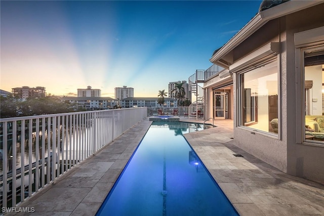 view of pool with a patio, stairway, fence, and a fenced in pool