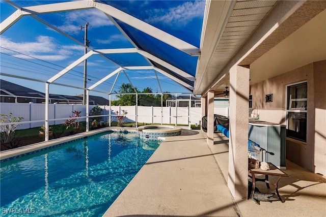 view of swimming pool featuring a lanai, an in ground hot tub, and a patio