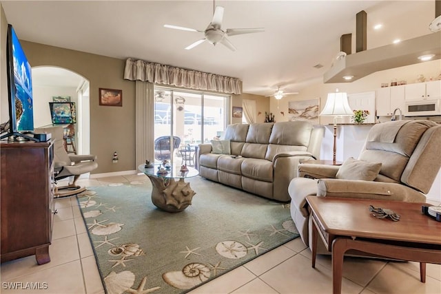 tiled living room featuring ceiling fan