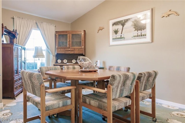 dining room with vaulted ceiling