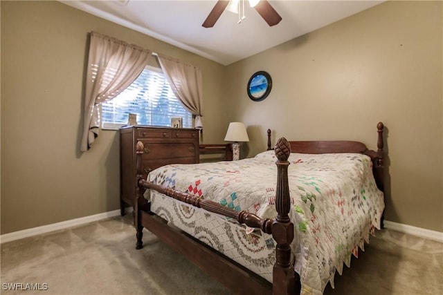 carpeted bedroom with ceiling fan and vaulted ceiling