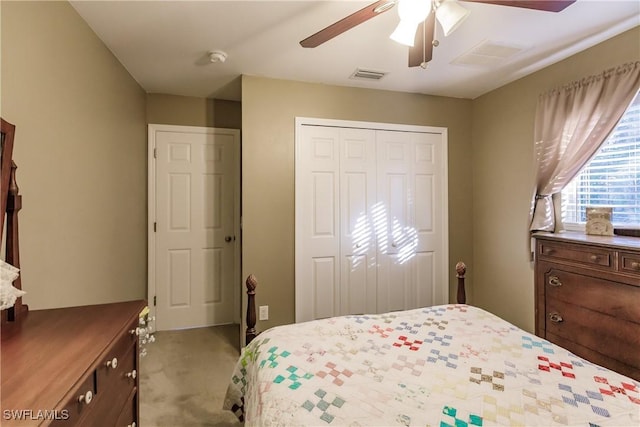 bedroom featuring light colored carpet and ceiling fan