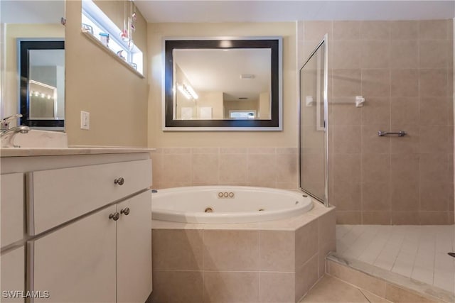 bathroom featuring tile patterned floors, plus walk in shower, and vanity