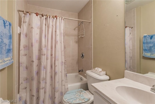 full bathroom with shower / bath combination with curtain, vanity, and toilet