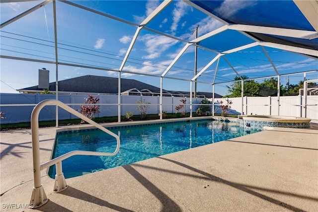 view of pool featuring a lanai, an in ground hot tub, and a patio