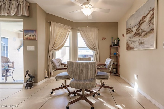 sitting room with ceiling fan and light tile patterned floors