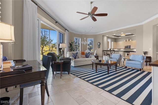 living room with a wealth of natural light, ornamental molding, and ceiling fan