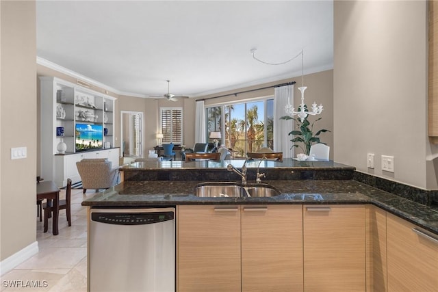 kitchen featuring dark stone counters, dishwasher, sink, and kitchen peninsula