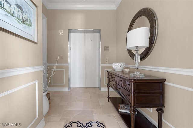 foyer entrance featuring ornamental molding and elevator