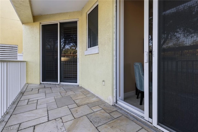 entrance to property with a balcony