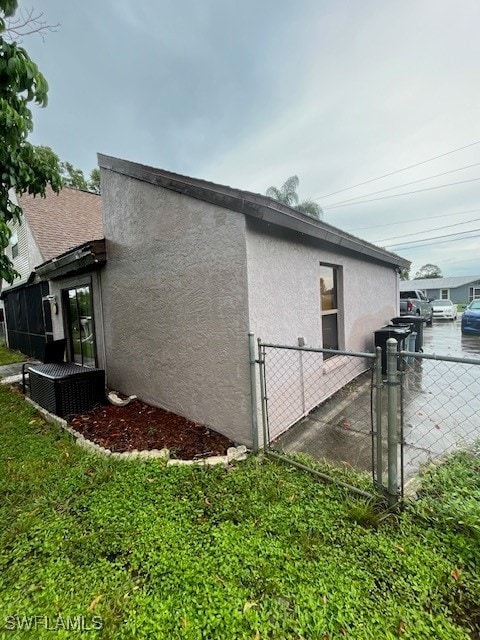 view of side of home with cooling unit