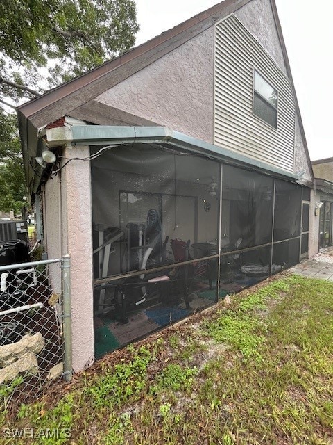 view of side of property with a sunroom