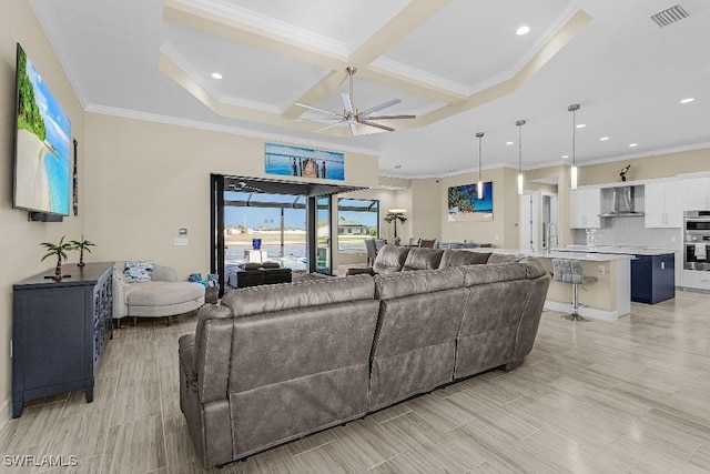 living room with beam ceiling, crown molding, ceiling fan, and coffered ceiling