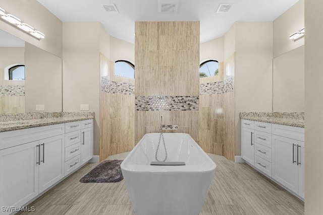 bathroom featuring a bathtub and vanity