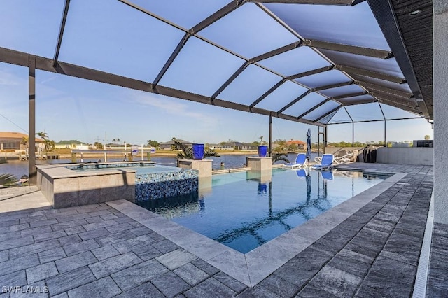 view of swimming pool with a lanai, an in ground hot tub, and a patio