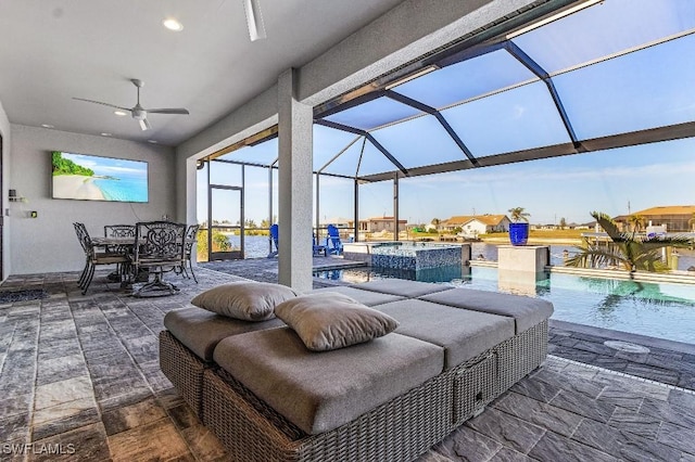 view of patio / terrace featuring ceiling fan, a lanai, and a pool with hot tub