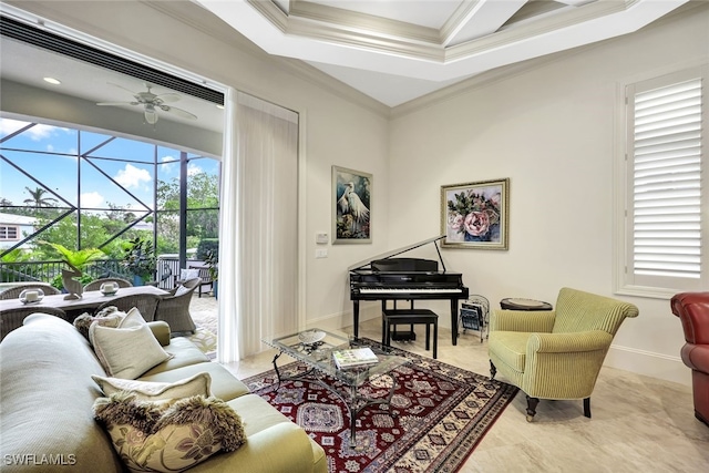 sitting room featuring ceiling fan, plenty of natural light, and ornamental molding