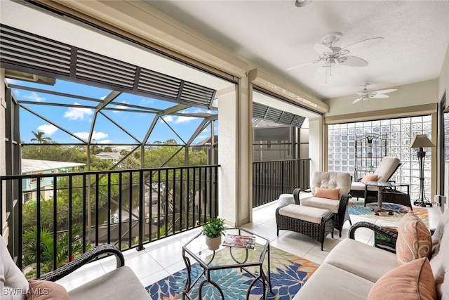 sunroom / solarium with ceiling fan and a wealth of natural light