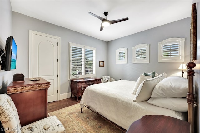 bedroom with ceiling fan and hardwood / wood-style floors