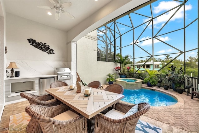 view of pool featuring a lanai, an outdoor kitchen, a grill, an in ground hot tub, and a patio