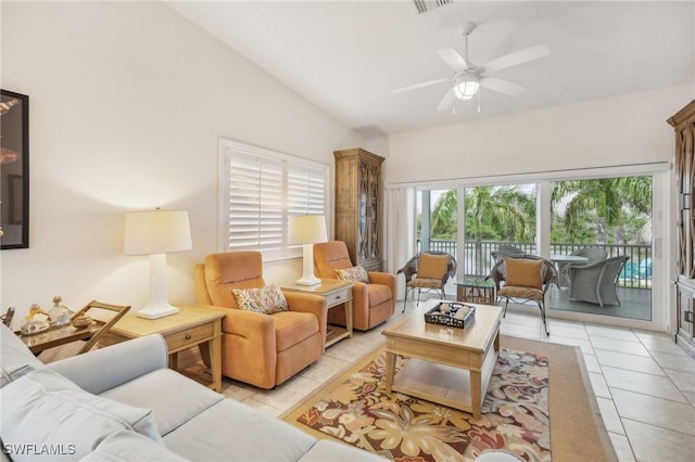 living room with light tile patterned floors, ceiling fan, and lofted ceiling