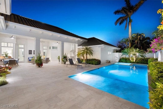 view of pool featuring ceiling fan and a patio area