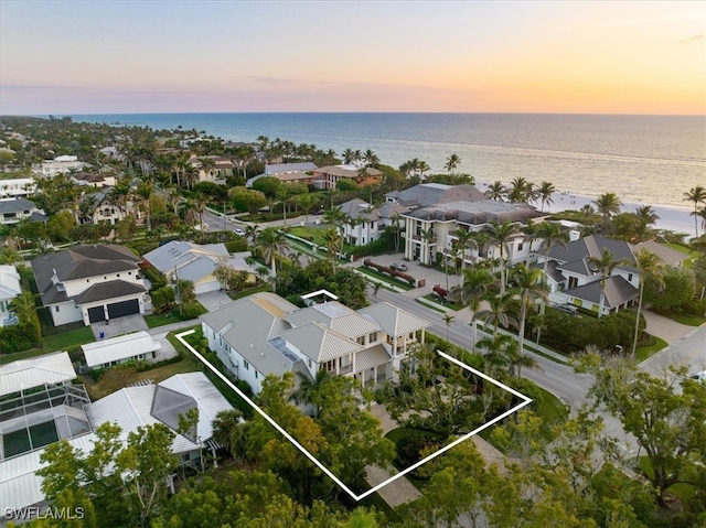 aerial view at dusk with a water view