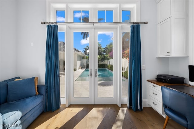 doorway to outside featuring french doors and dark hardwood / wood-style flooring