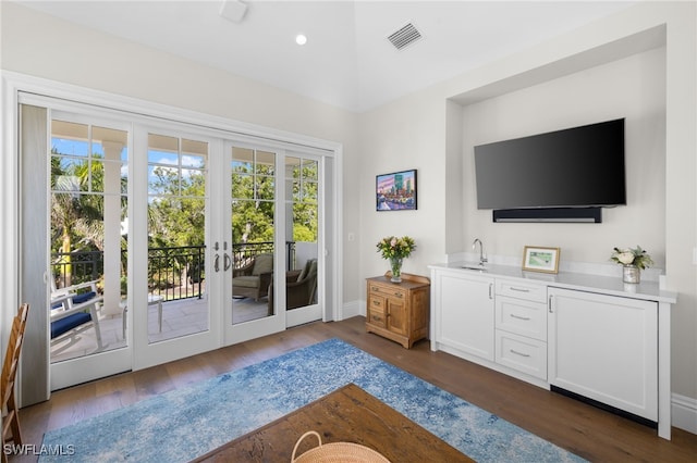 doorway featuring dark hardwood / wood-style floors and french doors