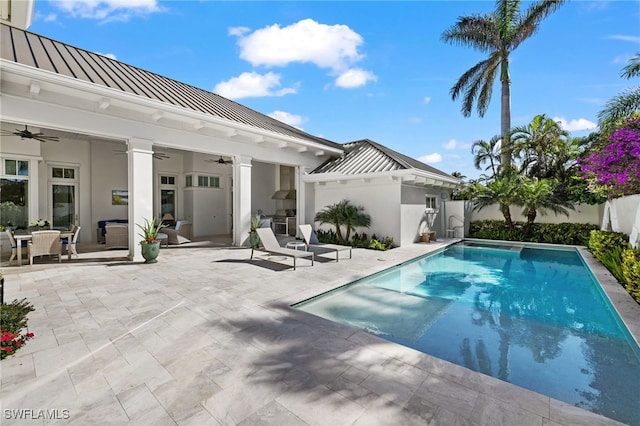 view of pool featuring ceiling fan and a patio area