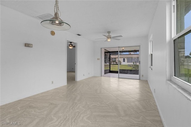 unfurnished room with ceiling fan