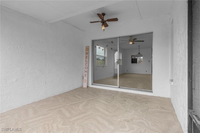 spare room featuring ceiling fan