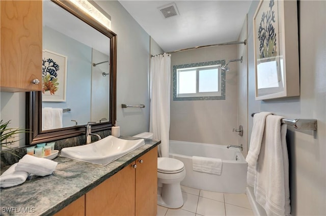 full bathroom with toilet, vanity, tile patterned floors, and shower / bath combo with shower curtain