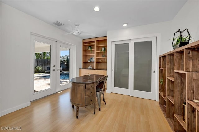 interior space with french doors, light wood-type flooring, built in features, and ceiling fan