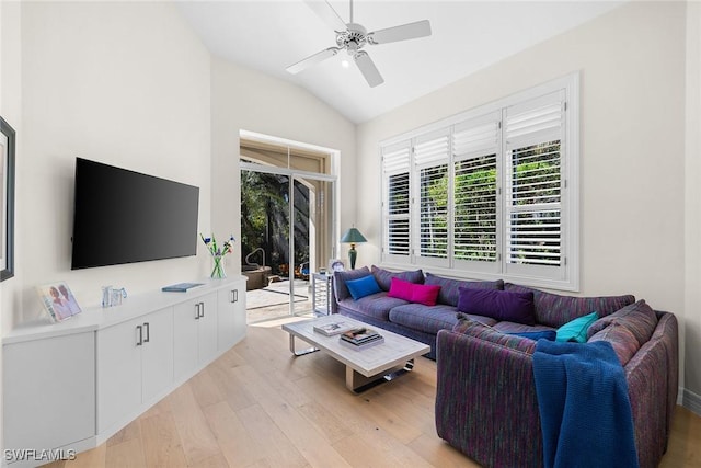 living room featuring light hardwood / wood-style flooring, vaulted ceiling, and ceiling fan