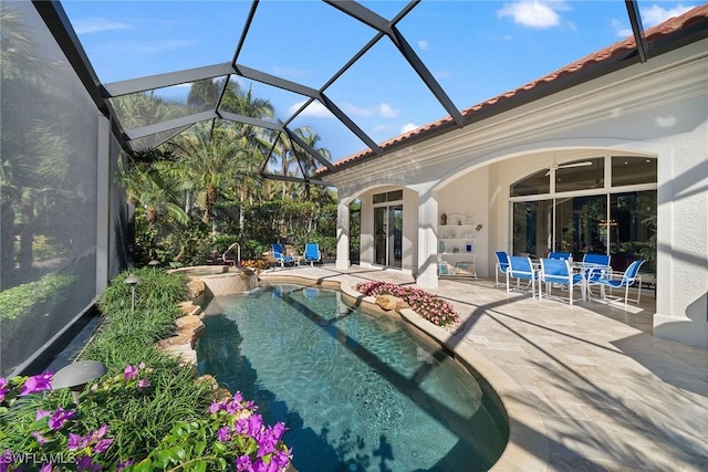 view of pool featuring a lanai and a patio area