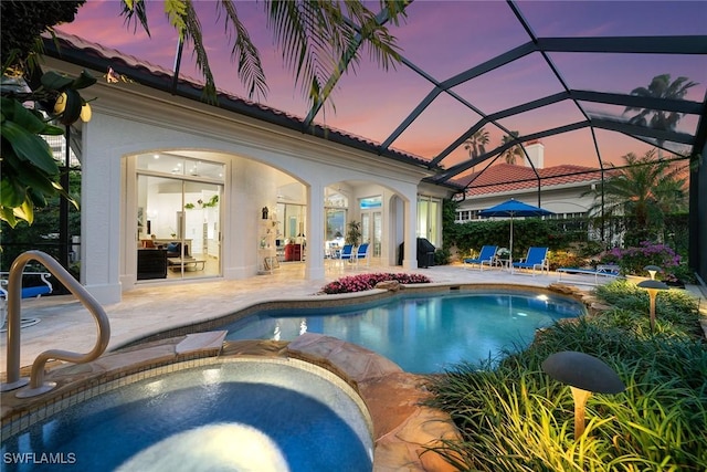 8723 La Palma Ln, Naples, FL 34108 - view of pool featuring a patio area, a pool with connected hot tub, a lanai, and a grill