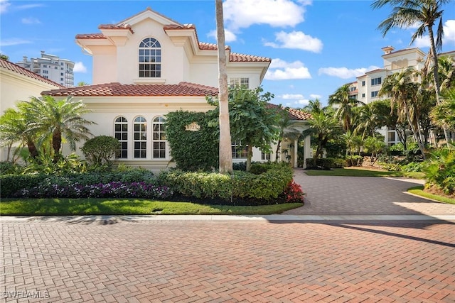 8723 La Palma Ln, Naples, FL 34108 - mediterranean / spanish home with stucco siding and a tile roof