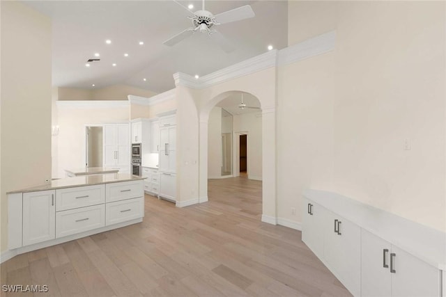 8723 La Palma Ln, Naples, FL 34108 - interior space with a ceiling fan, wood finished floors, recessed lighting, ornamental molding, and high vaulted ceiling