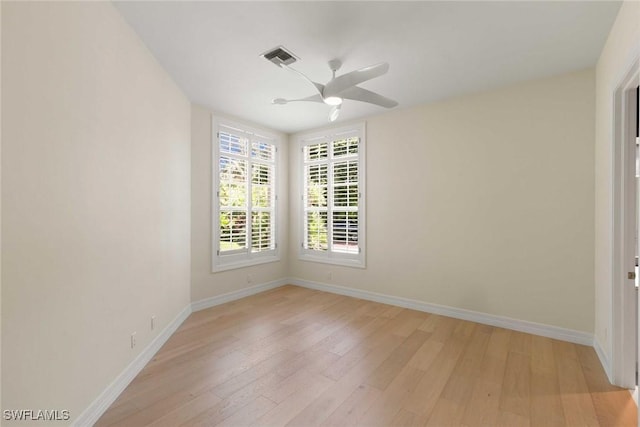 8723 La Palma Ln, Naples, FL 34108 - empty room with light wood finished floors and a ceiling fan
