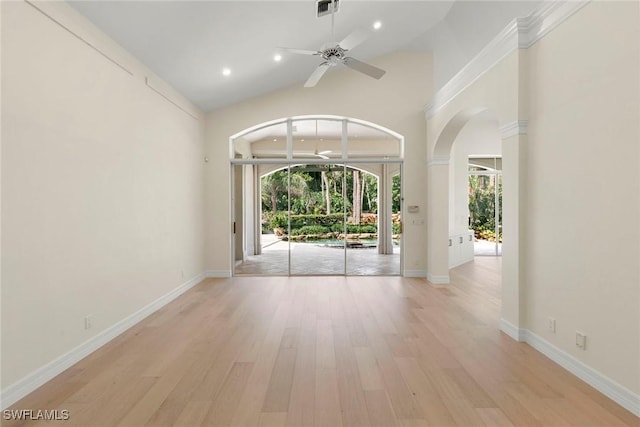 8723 La Palma Ln, Naples, FL 34108 - unfurnished room with ceiling fan, light wood finished floors, arched walkways, lofted ceiling, and recessed lighting