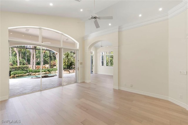 8723 La Palma Ln, Naples, FL 34108 - spare room featuring ceiling fan, wood finished floors, recessed lighting, arched walkways, and ornamental molding