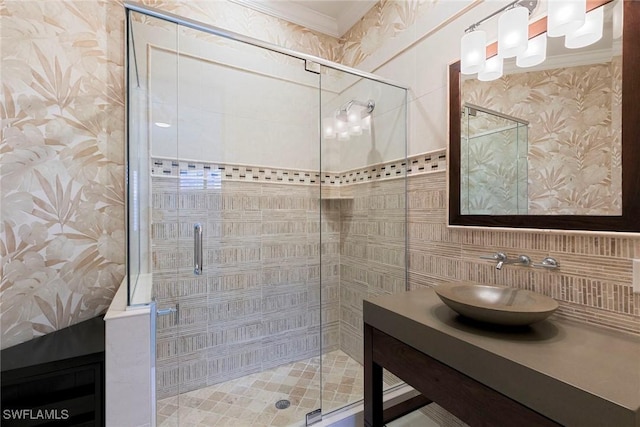 8723 La Palma Ln, Naples, FL 34108 - full bath with vanity, a stall shower, tile walls, tasteful backsplash, and crown molding
