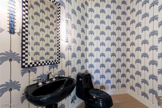 8723 La Palma Ln, Naples, FL 34108 - half bath featuring wallpapered walls and wood finished floors